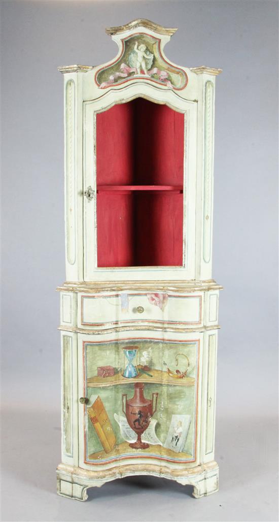 An 18th century design, Italian painted and parcel gilt standing corner cupboard, W.2ft 5in. H.6ft 7in.